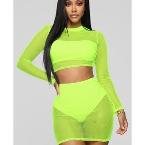 Lime green fishnet crop top and skirt